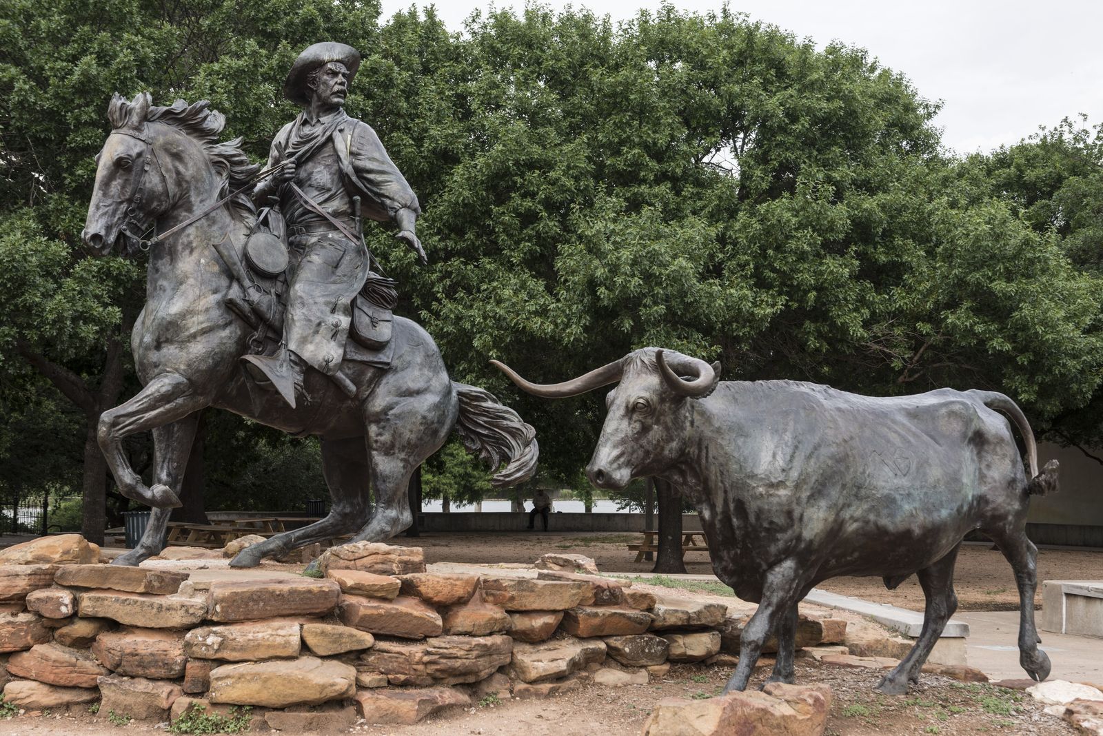 Robert Summers's Chisholm Trail Heritage sculpture beside the Brazos: a drover on horseback driving a longhorn.